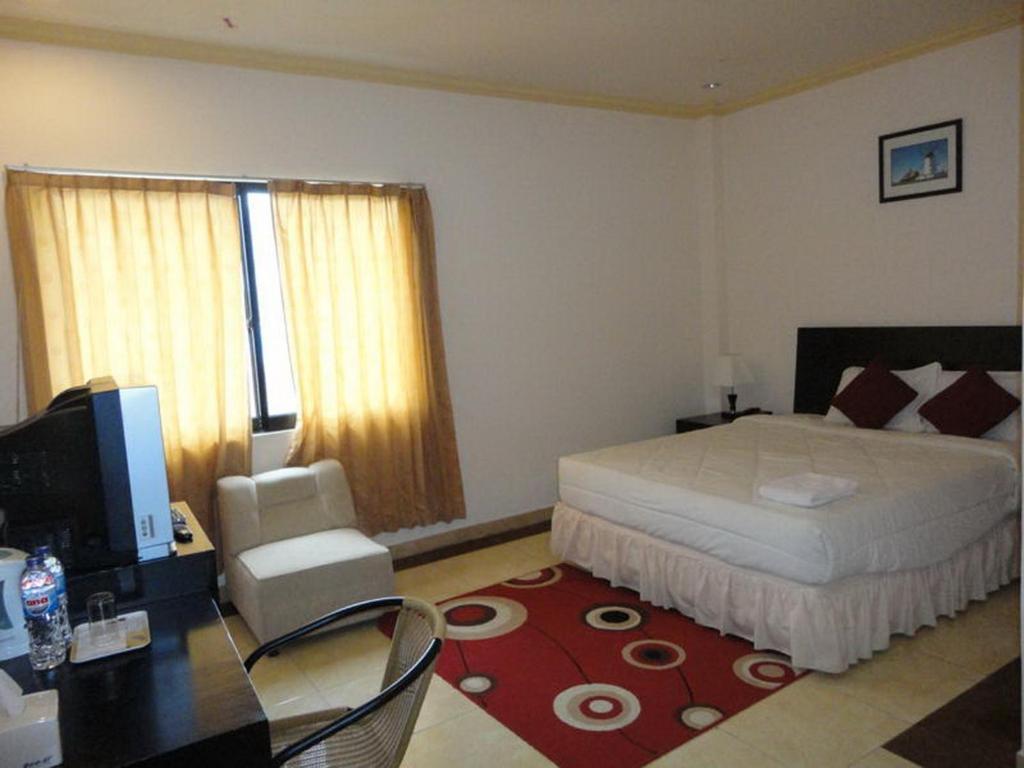 Grand Duta Hotel Palu Quarto foto